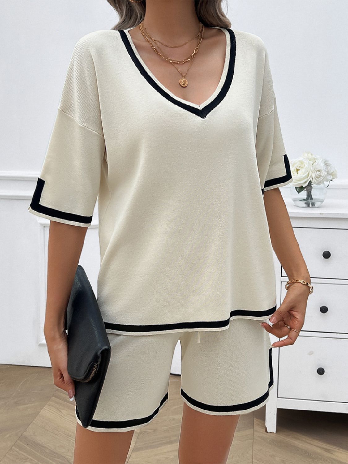 Women's contrast trim V-neck top and shorts set in white on model