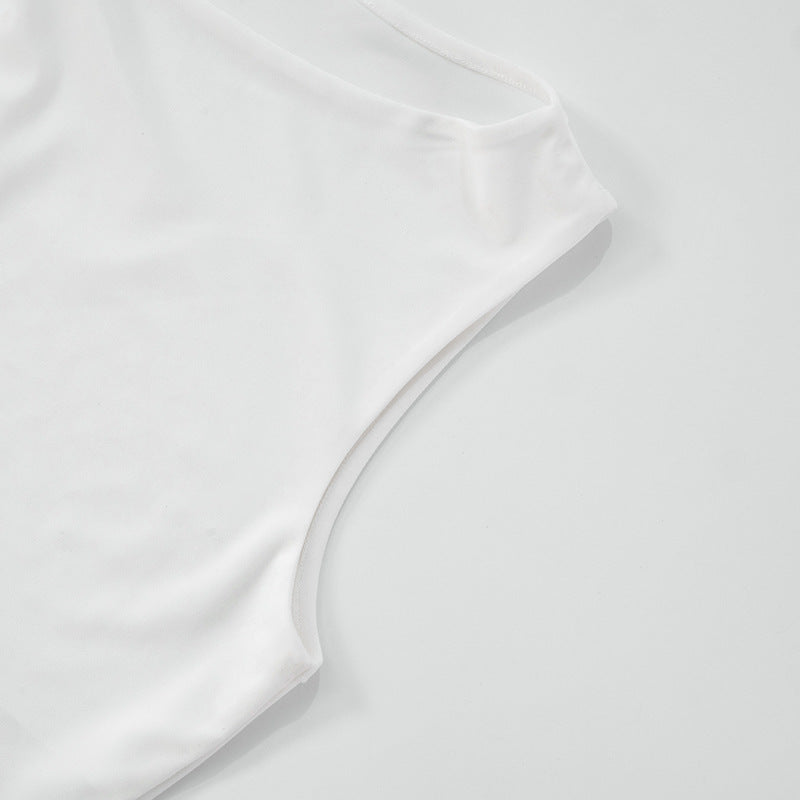 Close-up of sleeve of asymmetrical women top pattern on a light gray background