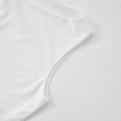 Close-up of sleeve of asymmetrical women top pattern on a light gray background