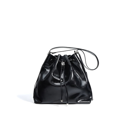 Black genuine leather drawstring  bucket shoulder bag on a white background