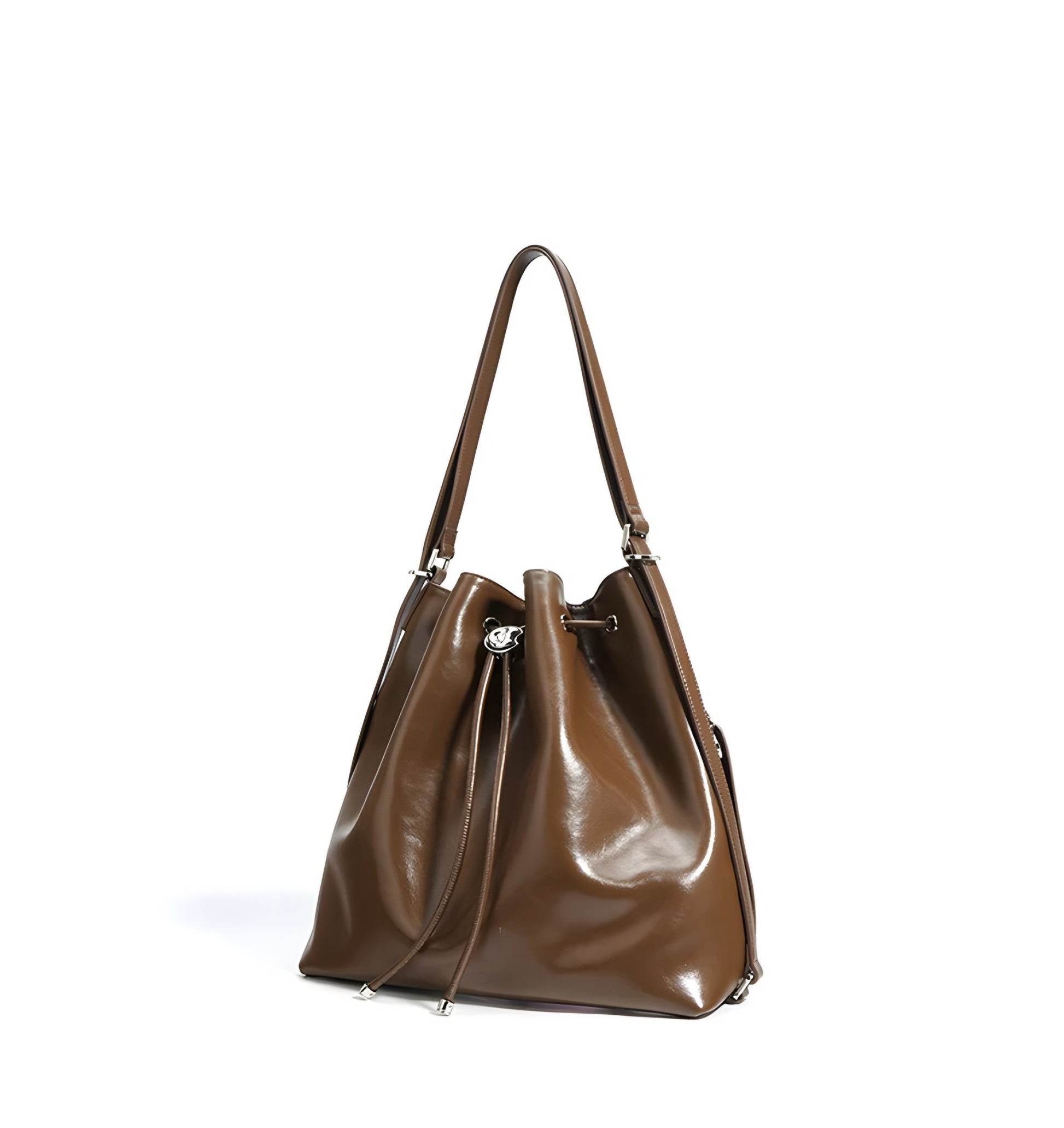 Angle view of brown genuine leather drawstring bucket shoulder handbag on a white background