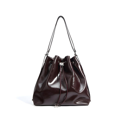 Deep Burgundy genuine leather bucket shoulder handbag with a drawstring closure on a white background front view