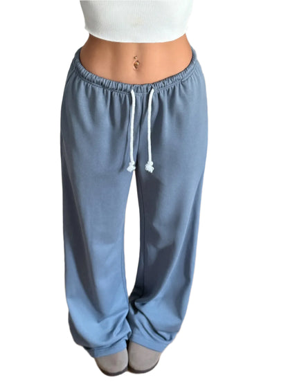Woman wearing Blue Cozy lounge sweatpants in wide-leg silhouette