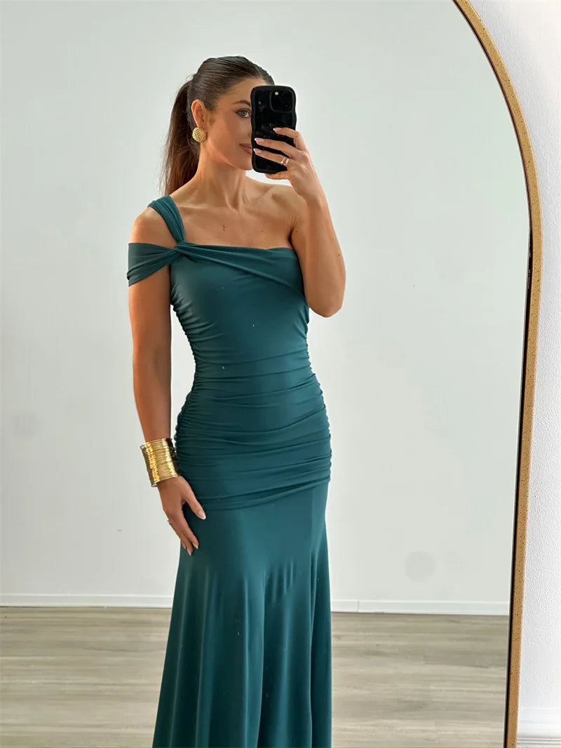 Model wearing elegant one-shoulder  bodycon green evening gown
