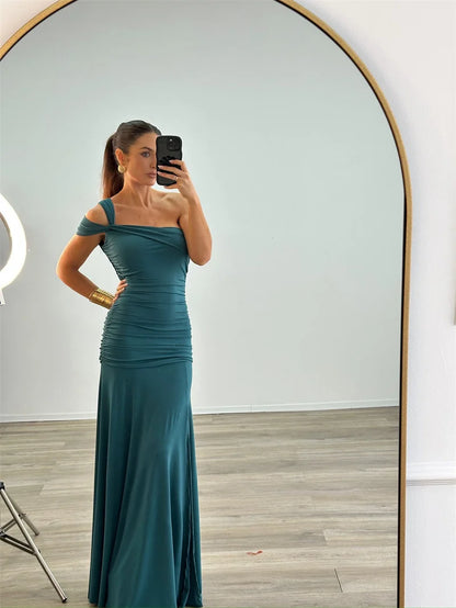 Model wearing elegant one-shoulder  asymmetrical bodycon green maxi dress
