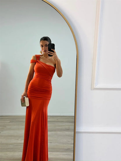 Model wearing elegant one-shoulder  asymmetrical bodycon orange maxi dress

