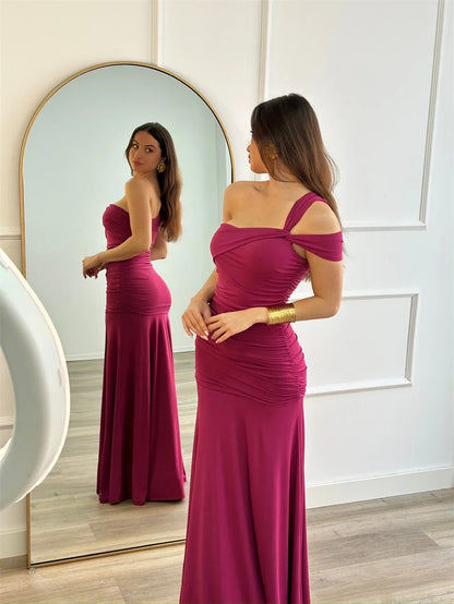 Full-length rose red /pink formal dress with one-shoulder neckline on model front and back view
