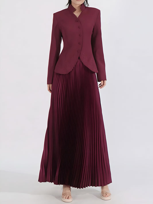 Woman wearing a burgundy button-up jacket and pleated maxi skirt women’s co-ord set