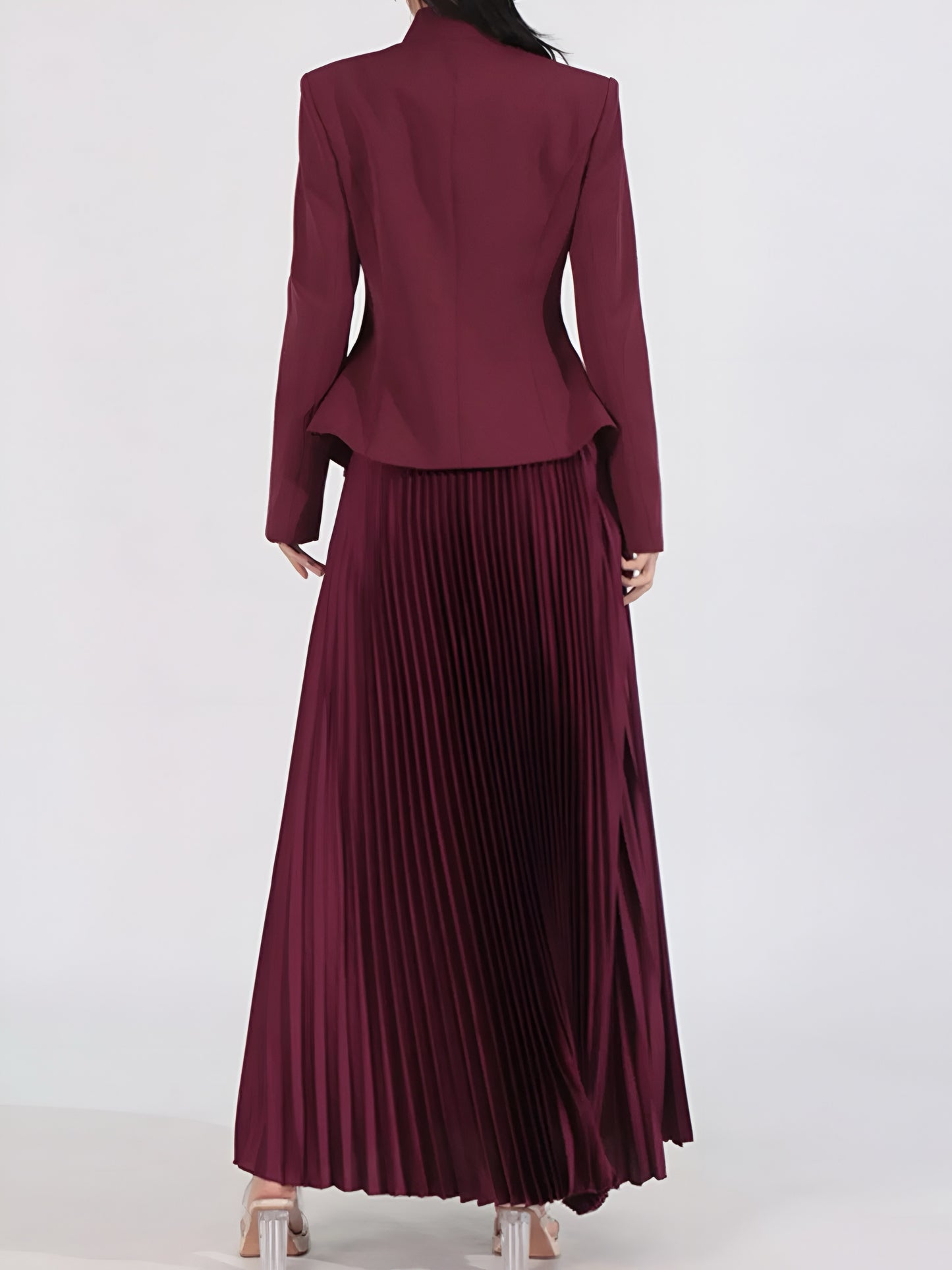 woman wearing an elegant Burgundy skirt suit set with a pleated skirt on a white background