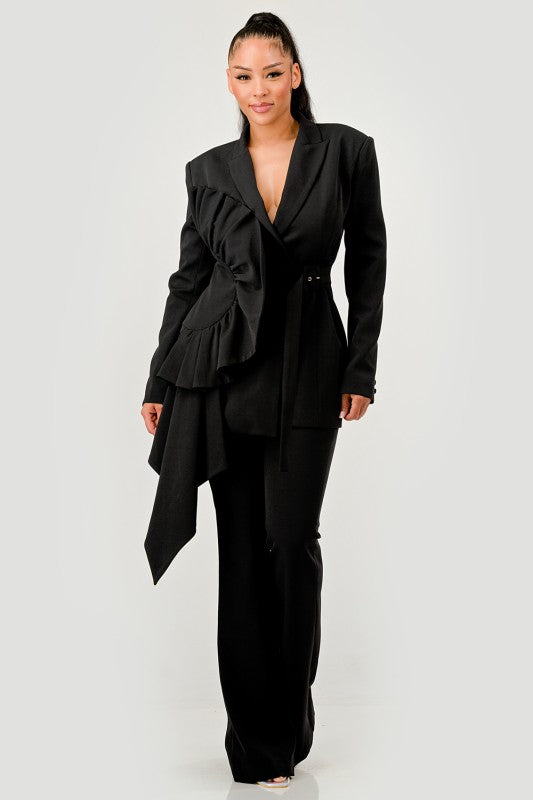 Woman wearing a black luxury women's belted blazer and wide-leg pant suit set on a white background front view