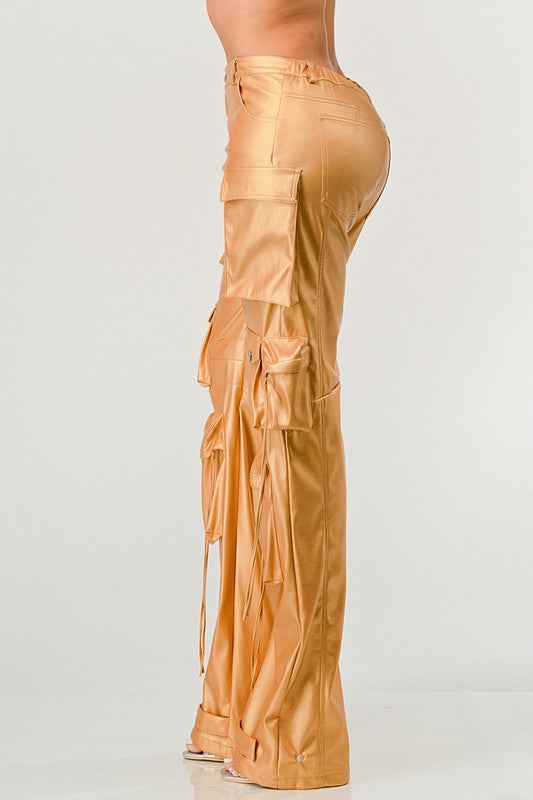 side view of women's gold faux leather high waist utility cargo pants with luxe shine 