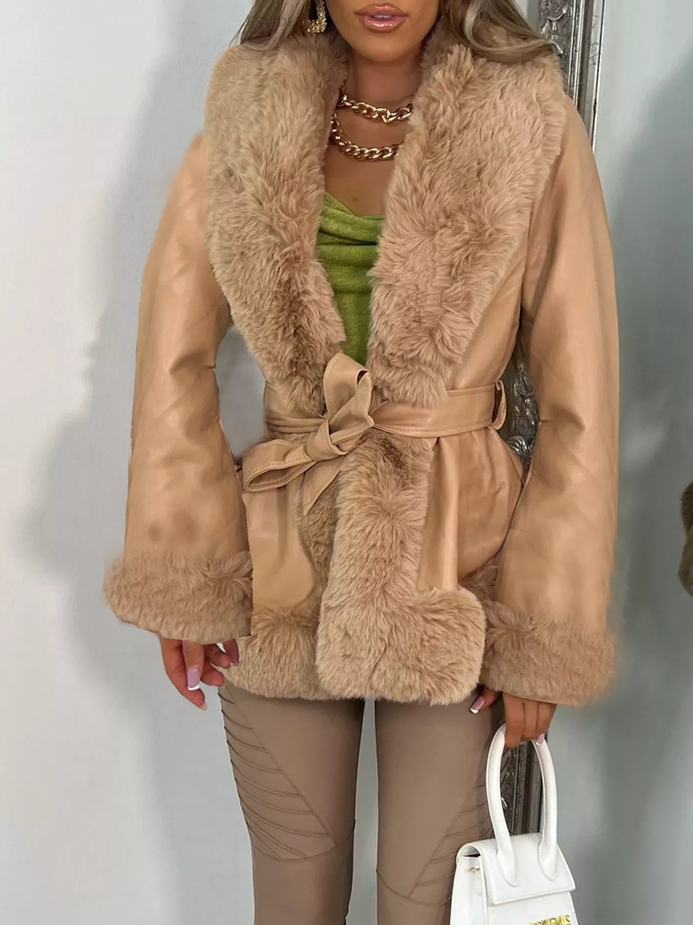 faux fur trimmed belted winter coat for women fashion front view on a model
