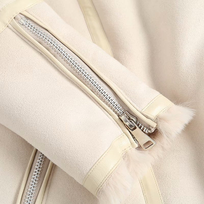 close up of zipper for beige/white faux shearling belted moto coat for women – winter fashion