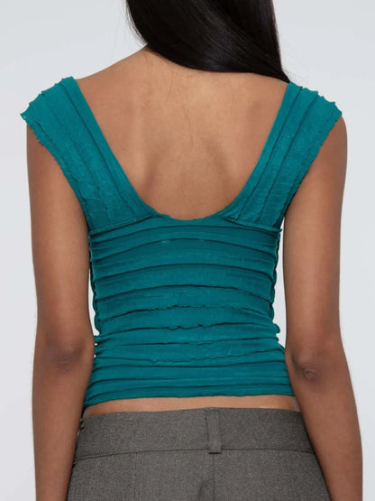 Teal sleeveless ruched top  back view worn by a model on a white background