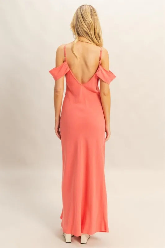Model posing in flattering cami maxi dress with sleek silhouette back view