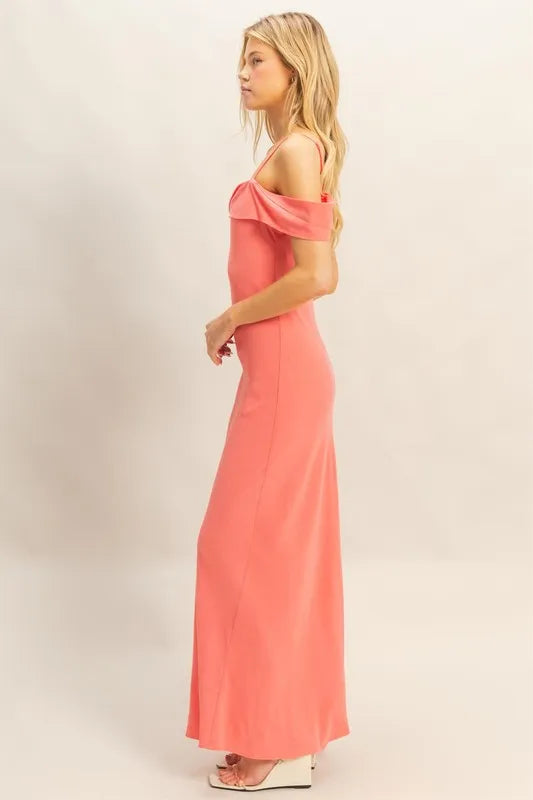 Model posing in flattering cami maxi dress with sleek silhouette side view