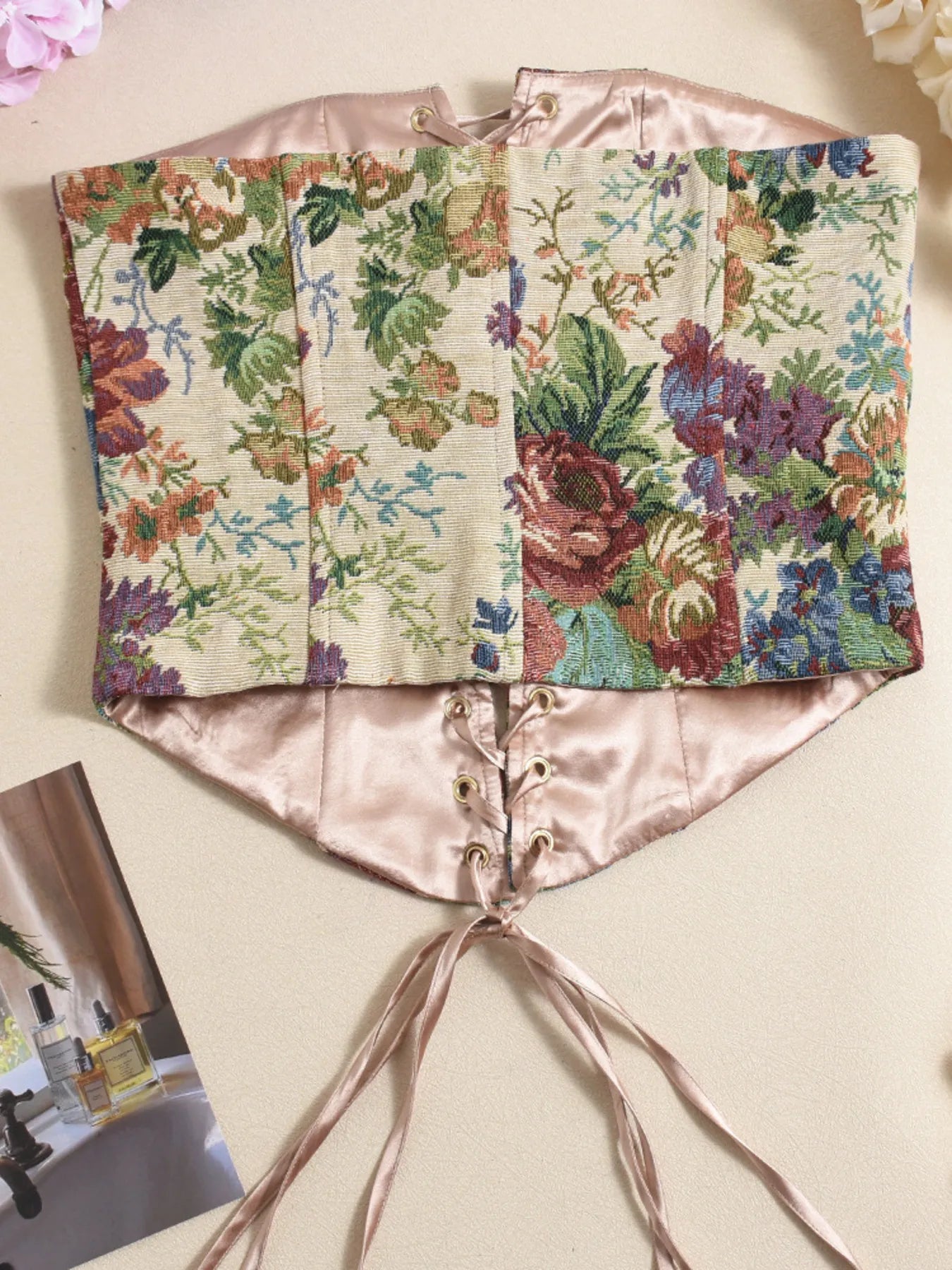 Back view of floral strapless tube top with lace-up front