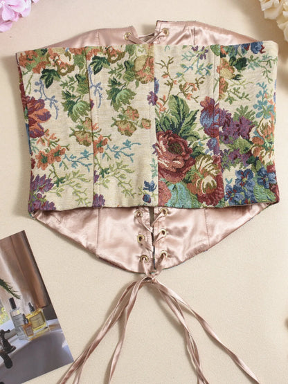 Back view of floral strapless tube top with lace-up front