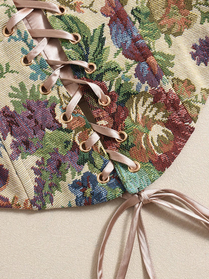 Close-up of a floral- summer tube top fabric with laces on a beige background