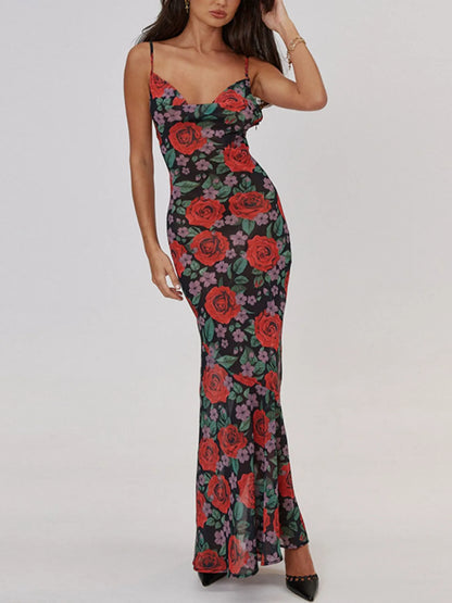 Woman wearing a floral bodycon summer maxi dress with red roses on a white background