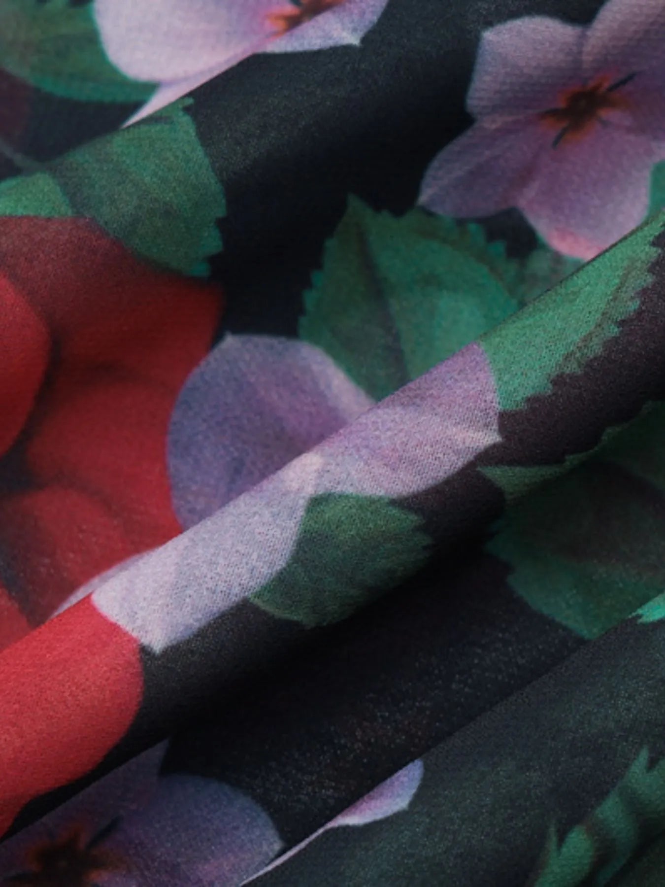 Close-up of fabric with colorful floral pattern
