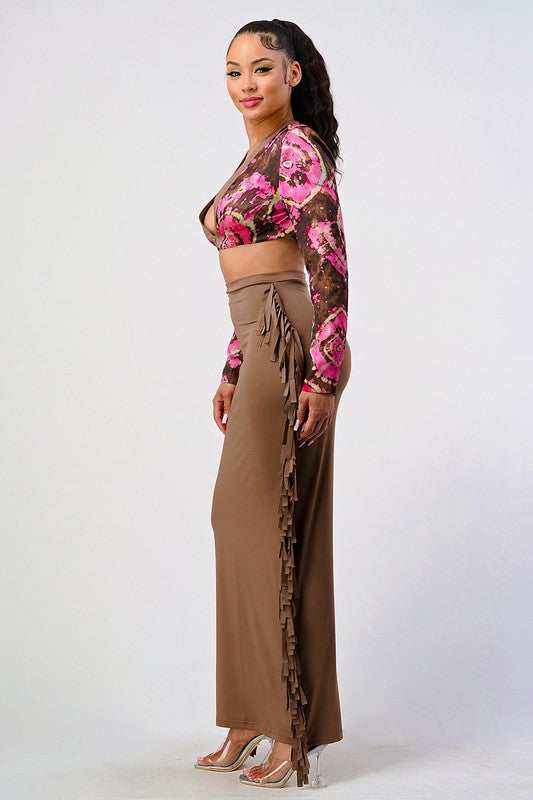side view of brown and pink floral crop top and high rise tassel stretchy two piece set worn by a woman on a white background