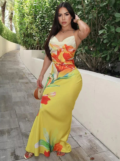 woman wearing floral print lace-up backless maxi dress in an outdoor setting front view