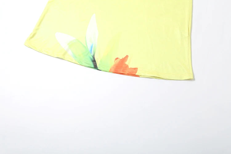 Close up of floral print lace up backless summer maxi dress hem on a white background