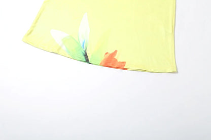 Close up of floral print lace up backless summer maxi dress hem on a white background