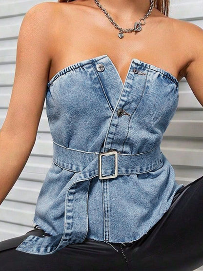 Woman sitting wearing frayed denim belted tube top 