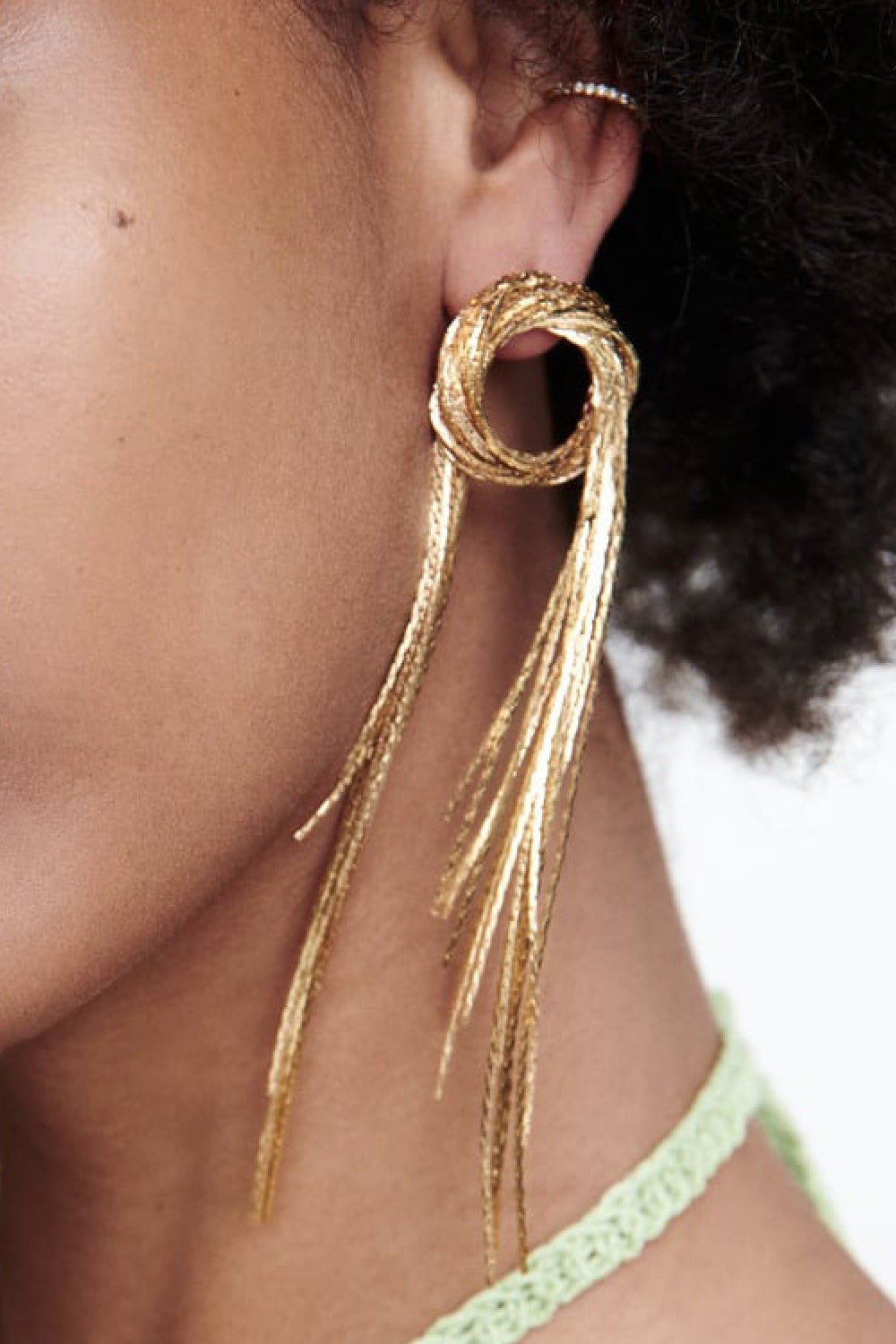 Fringed round copper statement earrings for women on model