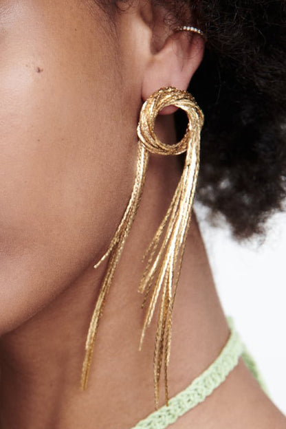 Fringed round copper statement earrings for women on model