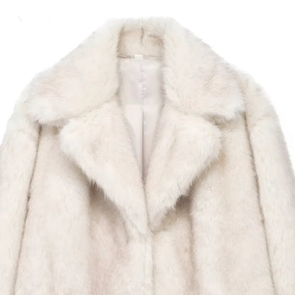 close of collared neckline of a luxury faux fur mid-length coat for women in plush texture