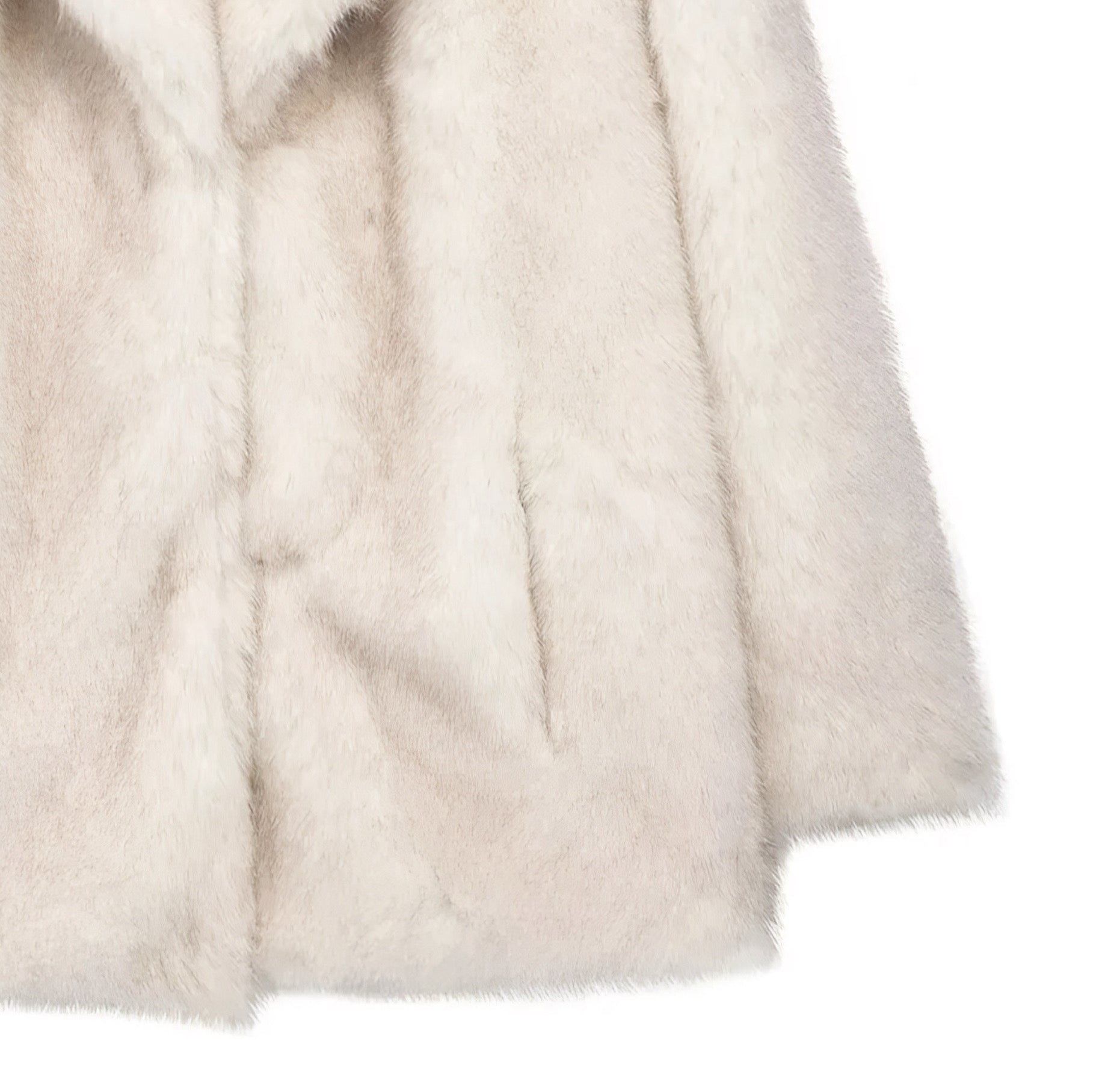 close up of pocket and sleeve o a luxury  faux fur mid-length coat for women in plush texture