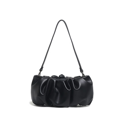 Black genuine leather pleated dumpling bag with shoulder strap with soft finish and luxury details