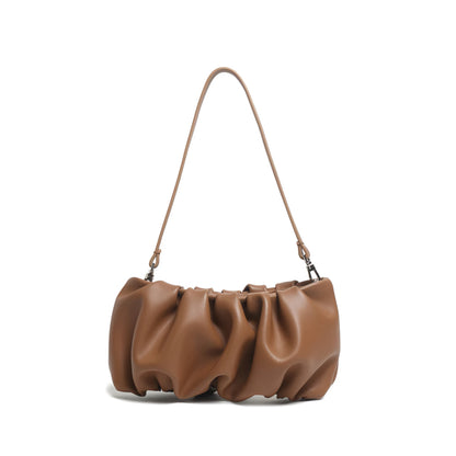 Brown genuine leather designer inspired  pleated dumpling bag with soft finish and luxury details on a white background