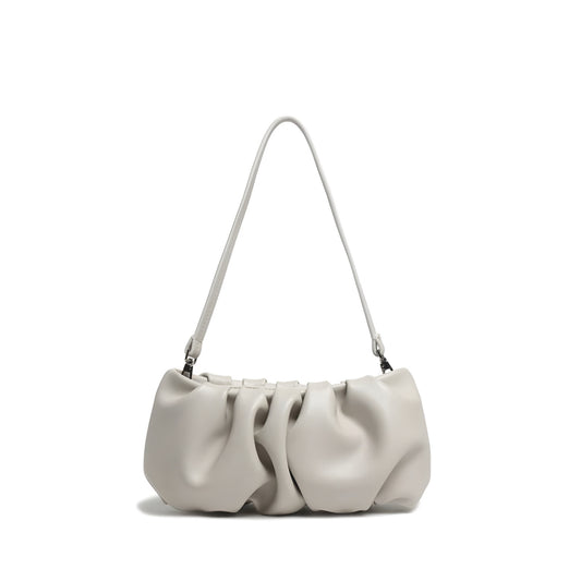 White pleated real leather handbag with gathered design and structured silhouette on a white background