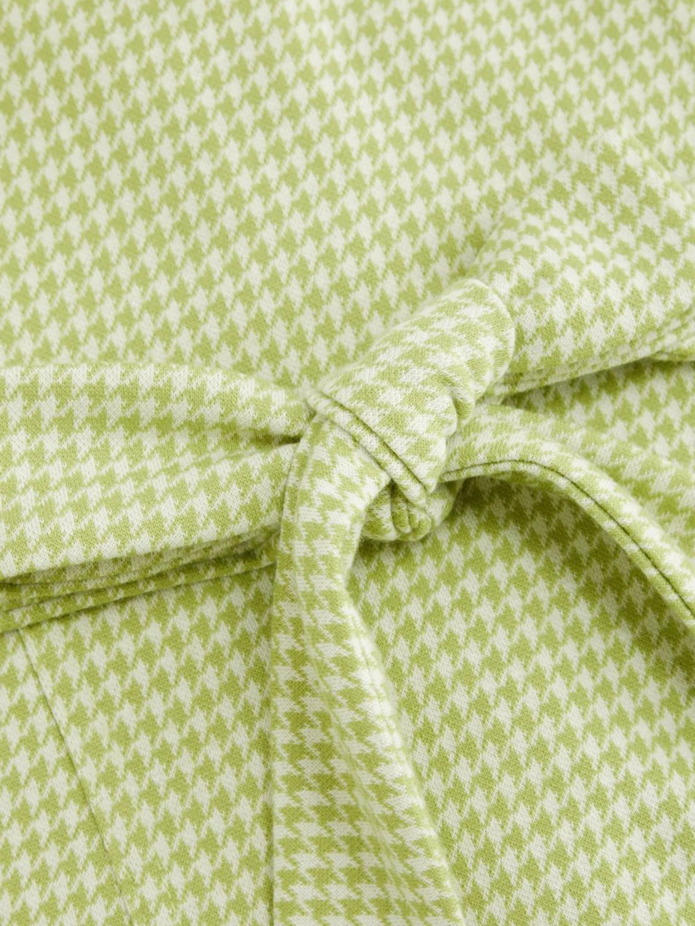 Close-up of Gingham Button-Front A-Line Mini Dress back fabric with a bow tie 