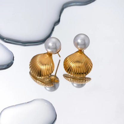 Sculptural gold shell earrings for beach or resort style