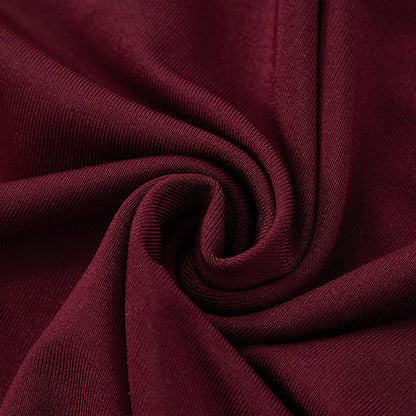 Close-up of dark red/burgundy polyester fabric for red evening maxi dress
