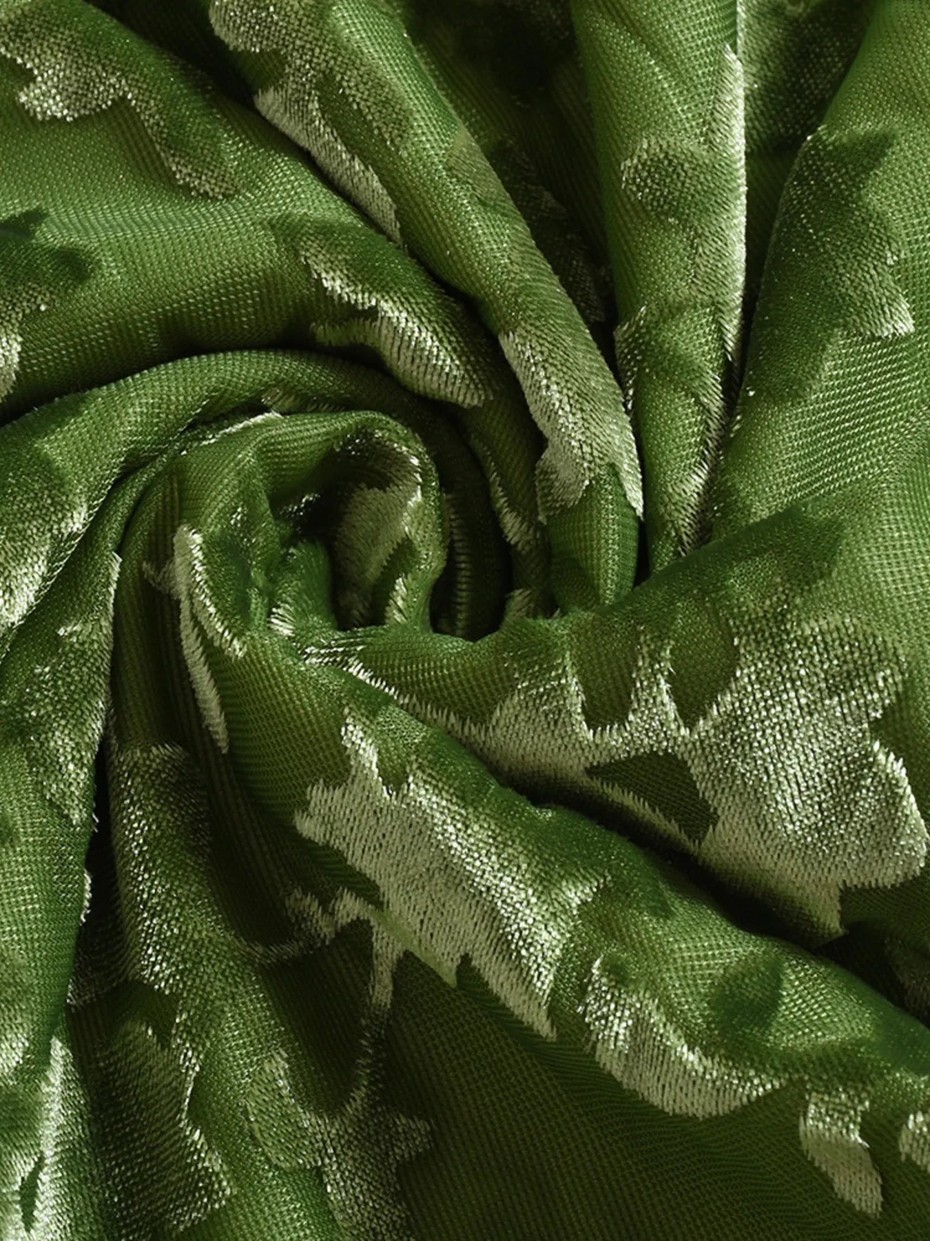 Close-up of green fabric with a subtle pattern for a halter Neck Cutout Midi Dress