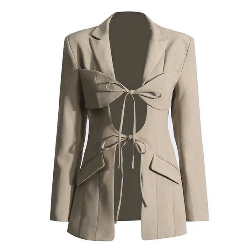A luxury fashion inspired  beige/khaki hollow-out cinched irregular  longs sleeve blazer with a deep v-neckline and lace up front detail on a white background