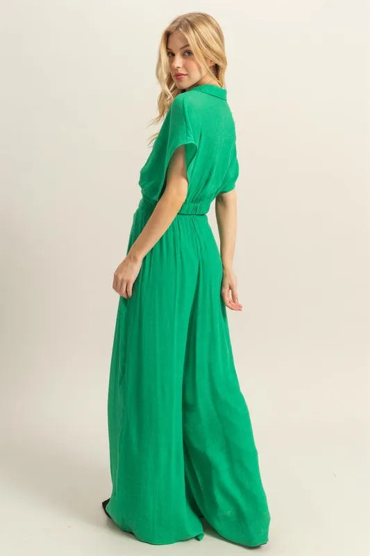 Women's green boho two-piece set with kimono sleeve crop top and wide leg pants back view on model 
