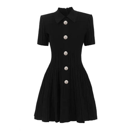 A black luxury knitted lapel A-line mini dress with short sleeves and buttons down the front-fit and flare design on a white background.
