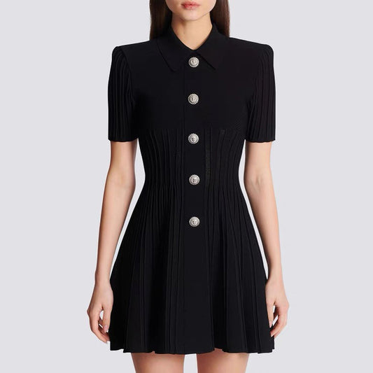 A woman wearing high fashion Black short sleeve  Knitted Lapel collar A-Line mini Dress with Statement Buttons on a white background.