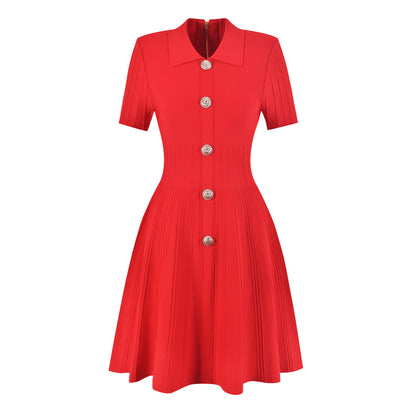 A red elegant classy knitted lapel A-line mini dress with short sleeves and statement buttons down the front on a white background