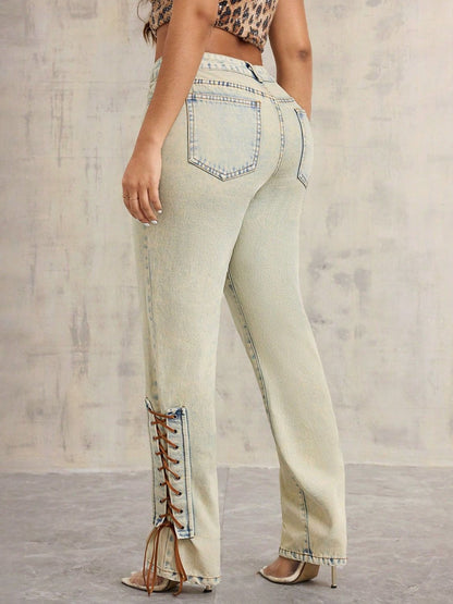 Model wearing vintage wash lace up denim back view