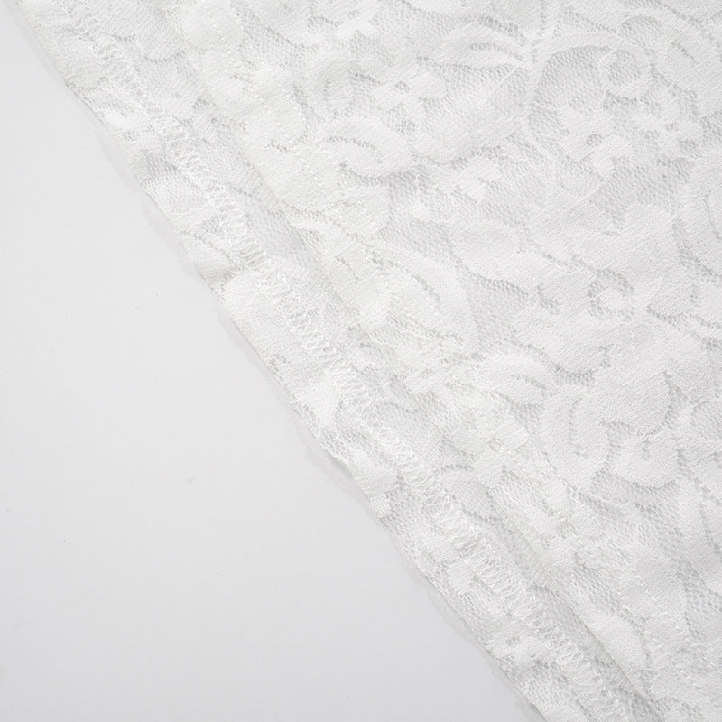 Close-up of hem with stitching white lace fabric with a subtle pattern