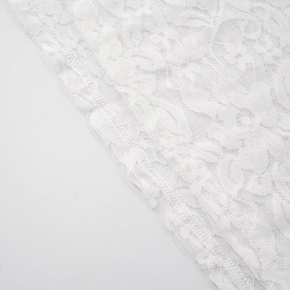 Close-up of hem with stitching white lace fabric with a subtle pattern