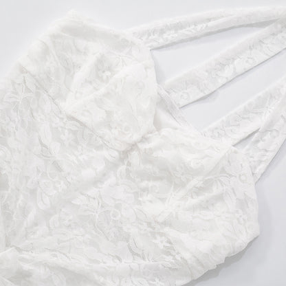Close up of lace backless maxi dress halter neckline on a light gray background